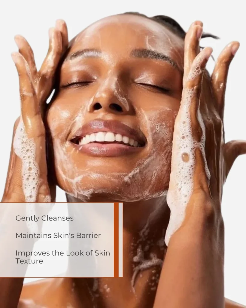 Smiling woman cleansing her face with a soft, gentle lather